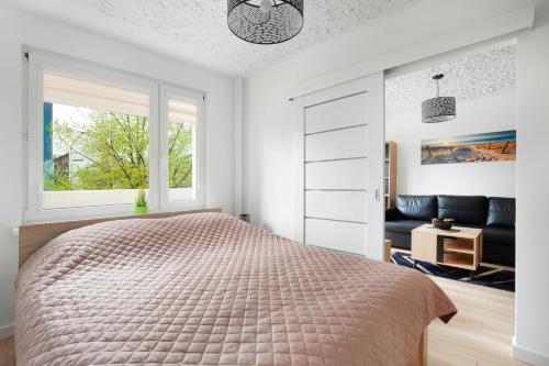 Gdynia Mare Apartment tesisinde bir odada yatak veya yataklar