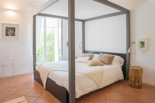 Ένα ή περισσότερα κρεβάτια σε δωμάτιο στο AGAVE - Villa Luisa, Pace e Relax a 2 passi dal mare