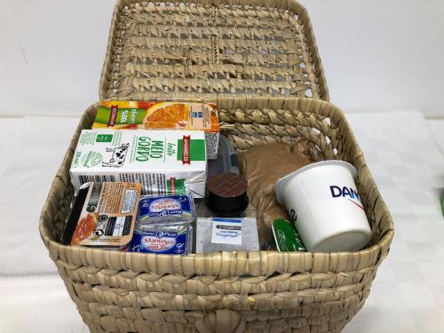 a basket with food and other items in it at Lavradores Boutique Guesthouse in Évora