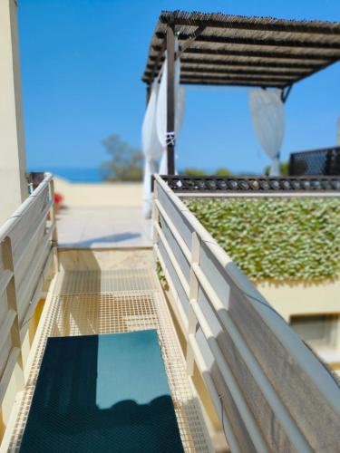 a swimming pool on the roof of a house at Sea Breeze - Home with a View in Bouzéïka
