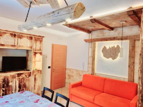 TV a/nebo společenská místnost v ubytování Casa Vacanze Dorigoni