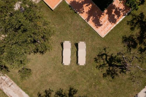 an overhead view of two cars parked in a yard at Fedra Plakias Apartments in Plakias