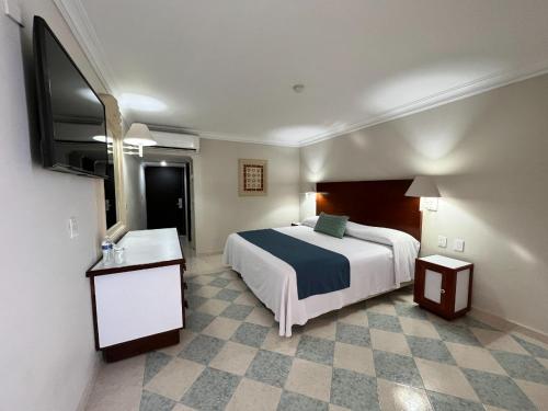 Cama o camas de una habitación en Hotel Sands Arenas