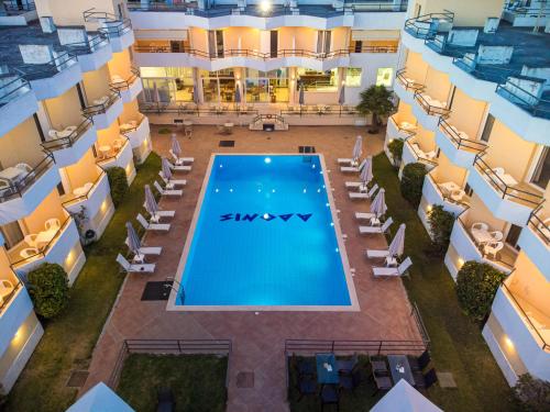 an overhead view of a swimming pool in a building at Adonis Hotel in Mitikas
