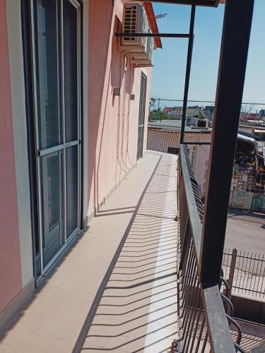 a balcony of a building with a view of the ocean at Mary House in Pompei