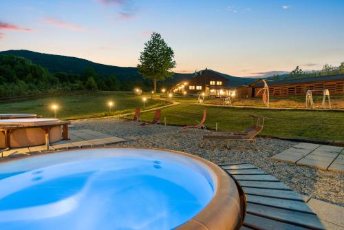 a hot tub in the backyard of a house at B&B Plitvice Lakes Villa Irene in Plitvička Jezera
