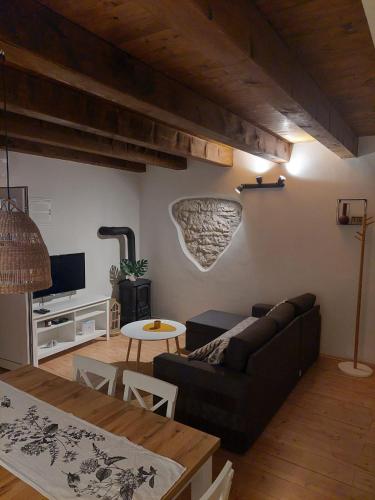 a living room with a couch and a table at Casa Nonna Tereza in Premantura