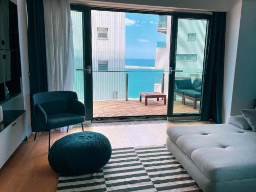 Beachfront Designer Apt, 100 sqm, 2-bath, huge terrace on the sea shore