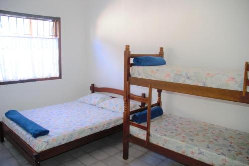 Ένα ή περισσότερα κρεβάτια σε δωμάτιο στο Marujo Hostel