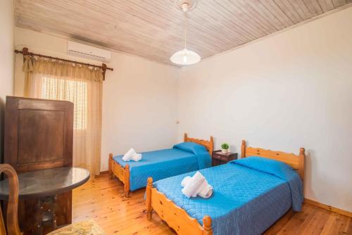 Postel nebo postele na pokoji v ubytování Nona Marina's refurbished family home