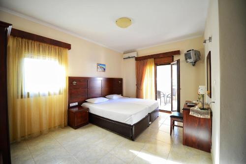 Postel nebo postele na pokoji v ubytování Artemis Rooms Leptokarya