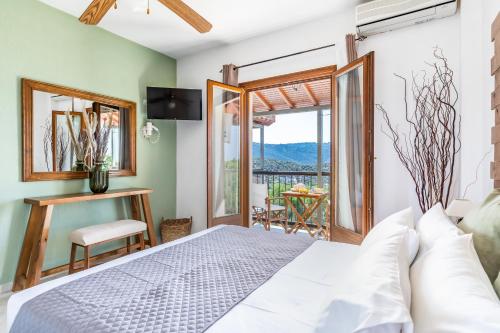 Postel nebo postele na pokoji v ubytování Giasemi Apartments