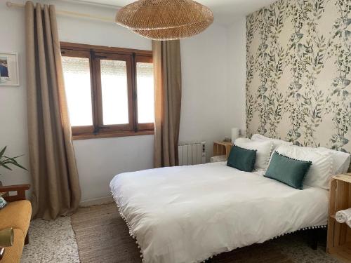 Postel nebo postele na pokoji v ubytování Casa Árbol