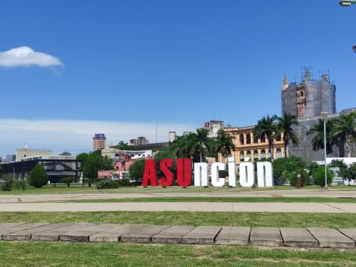 a large sign in the middle of a city at Sueño Luqueño in Luque