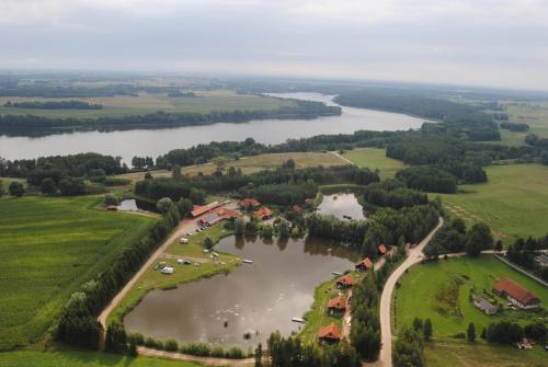an aerial view of a river and a village at Siedlisko Konradówka in Olecko