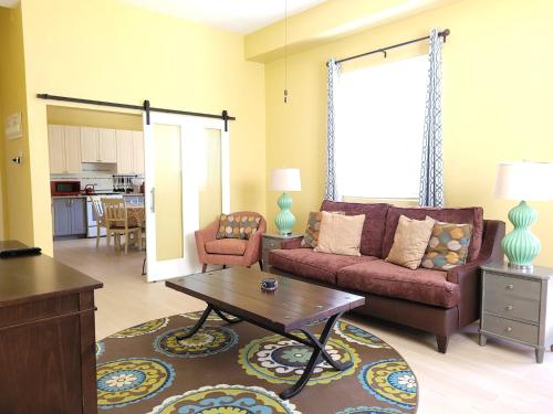 a living room with a couch and a coffee table at Keep Cool Guesthouse in Gros Islet