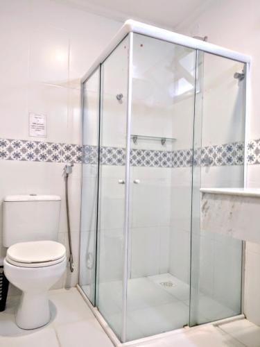 a bathroom with a shower and a toilet at Pousada Zazen in Vale do Capao