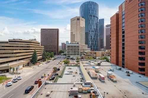 a city with a street with cars and buildings at ELEMENT ON FIRST by Manna in Calgary