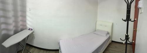 Giường trong phòng chung tại DARUL AMAN Homestay Jitra