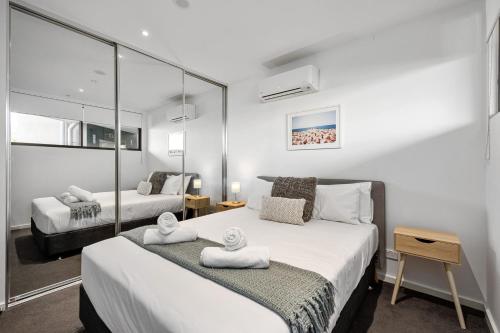 Ένα ή περισσότερα κρεβάτια σε δωμάτιο στο Wattle Beachside Apartment