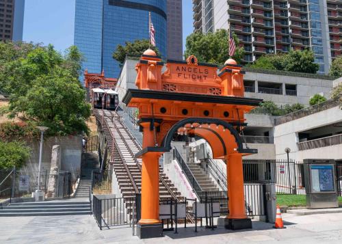 an orange structure with stairs in front of a building at Sky-Rise Apartments in Los Angeles