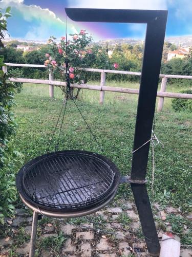 a basket with a swing on a pole at Villa Paola in Arezzo