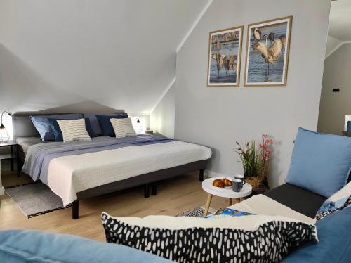 Posteľ alebo postele v izbe v ubytovaní Apartament GRAY CRANE