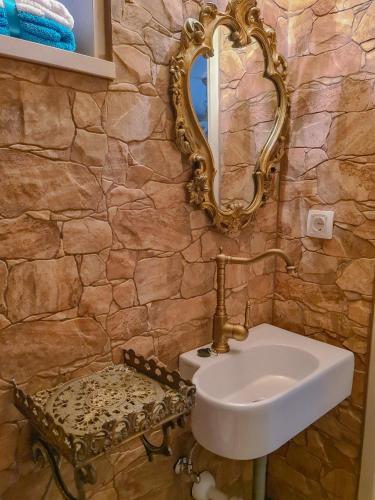 a bathroom with a sink and a mirror at Kaya house in Nerežišća