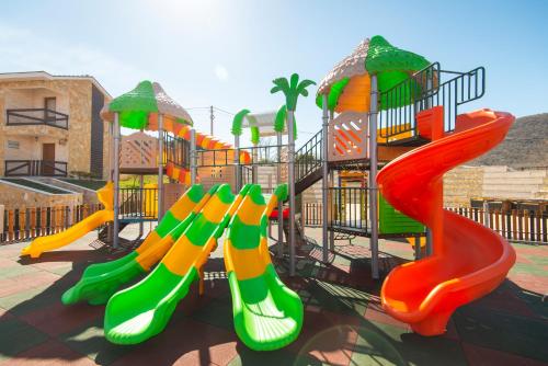 a playground with a slide and a slide at Ethno Village St George in Cetinje