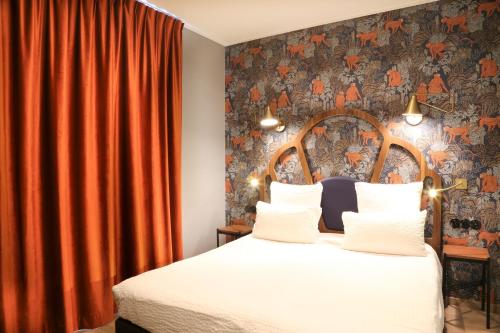 Кровать или кровати в номере Hotel André Latin