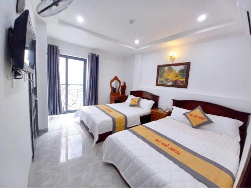 Giường trong phòng chung tại HANZ Dai Hai Hotel