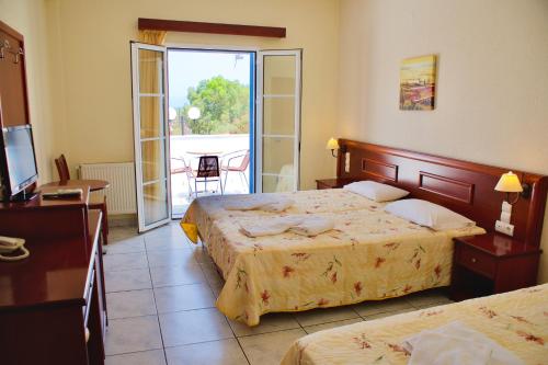 Postel nebo postele na pokoji v ubytování Venardos Hotel