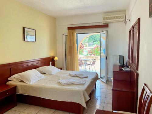Postel nebo postele na pokoji v ubytování Venardos Hotel