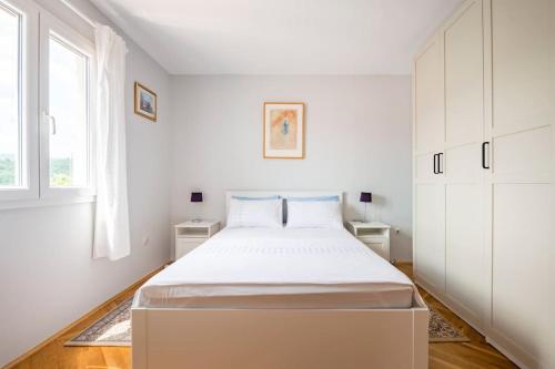 Säng eller sängar i ett rum på Holiday home Goranka
