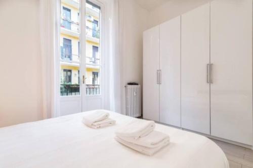 Posteľ alebo postele v izbe v ubytovaní Delizioso appartamento all Isola by Easylife