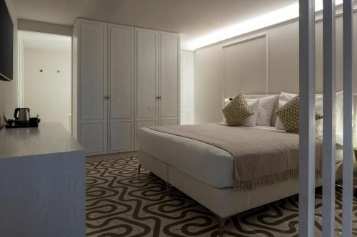 Katil atau katil-katil dalam bilik di Noga by Isrotel Collection