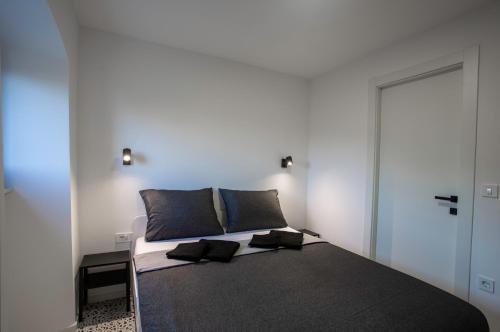 A bed or beds in a room at Premium Apartments Villa Ula,Free Private PARKING