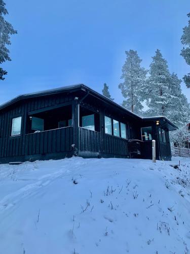 a cabin in the snow with snow covered ground at 1125 Fjällstugan in Lofsdalen