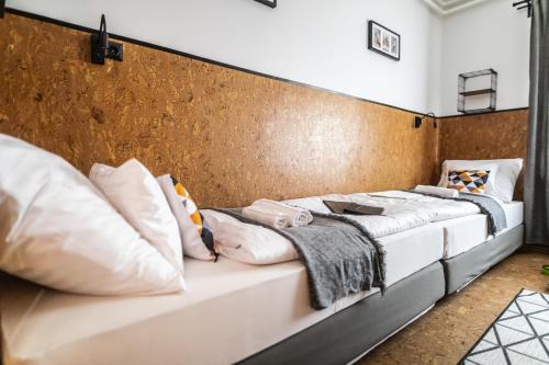 a long white couch with pillows on it at 4 Évszak Völgyhotel in Mátrafüred
