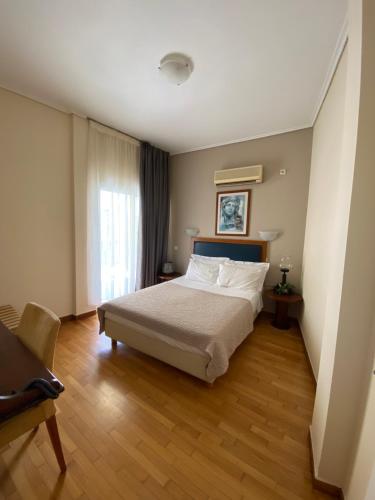 Posteľ alebo postele v izbe v ubytovaní Adams Hotel