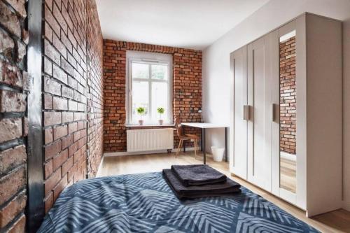 Posteľ alebo postele v izbe v ubytovaní Archirent Apartament Waryńskiego