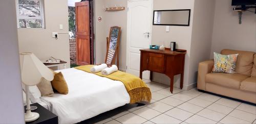 Ένα ή περισσότερα κρεβάτια σε δωμάτιο στο Zeezicht Unit with seaview from terrace