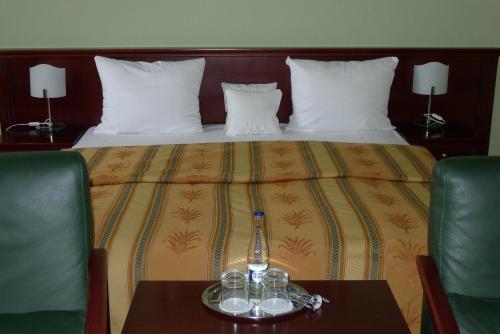 Postel nebo postele na pokoji v ubytování Hradná brána u Slovanov