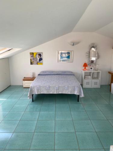 Giường trong phòng chung tại Giardino sul mare