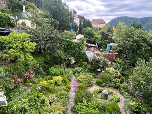 an aerial view of a garden with flowers and plants at Winzerhof - Gästehaus Stöger in Dürnstein