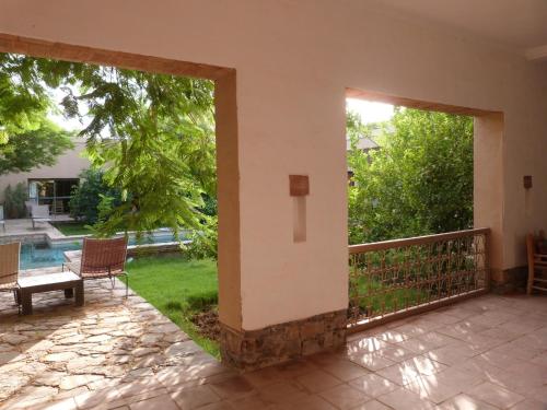 an open patio door with a view of a yard at Dar al Hossoun in Taroudant