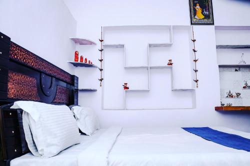 Postel nebo postele na pokoji v ubytování Jagannath guest house