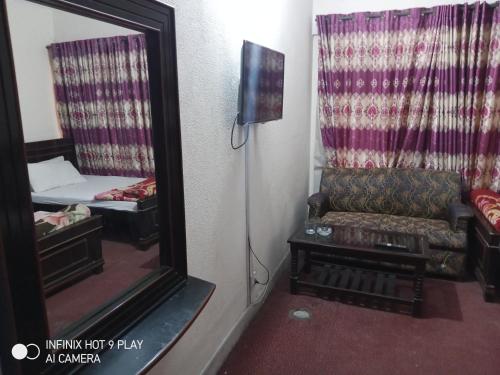 TV a/nebo společenská místnost v ubytování HOTEL DE GRAND