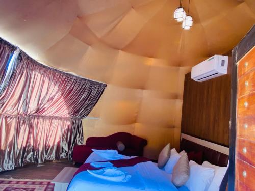a bedroom with two beds in a tent at wadi rum land mars in Wadi Rum