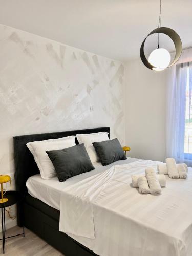 Postel nebo postele na pokoji v ubytování Apartmani CUBE L